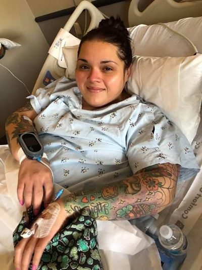 Felicia Urdiales in a hospital bed.