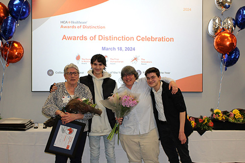 PRH Frist Volunteer 2023 Linda Bolduc - Volunteers accepts award, accompanied by her family.
