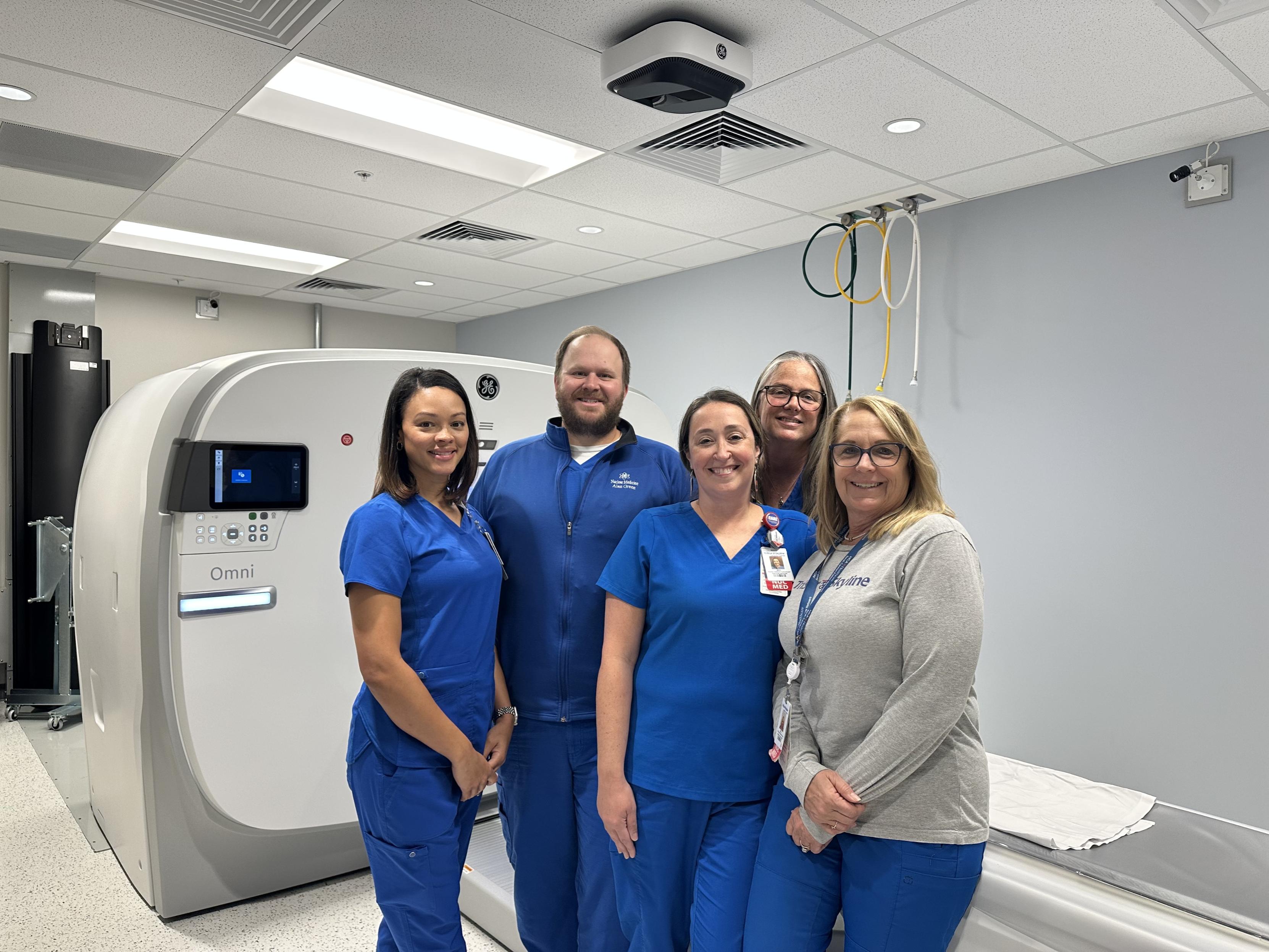 Pictured is the PET/CT team at TriStar Skyline in front of the in-house PET/CT Scanner.