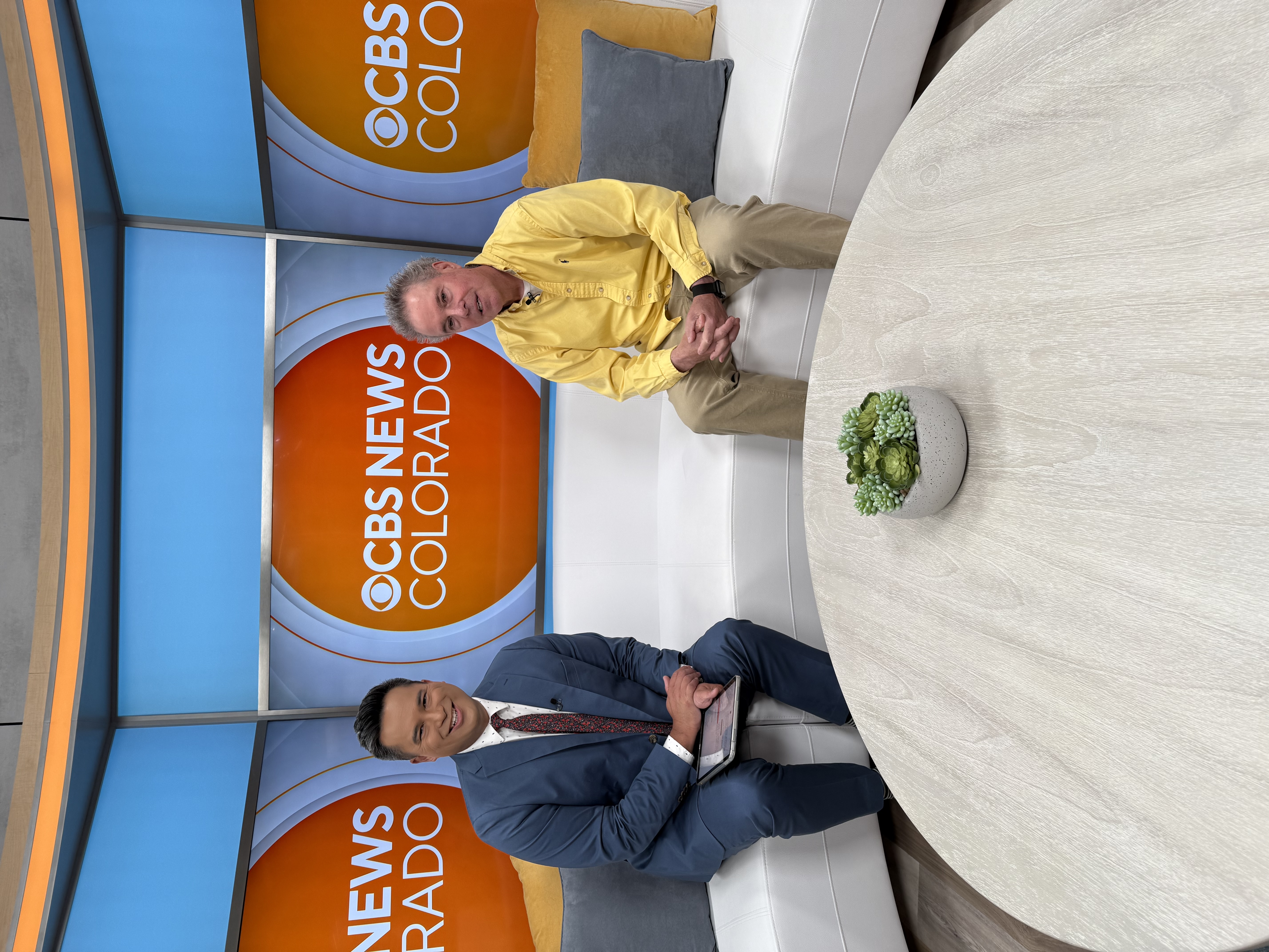 Steve Howard sharing advice on the couch set of CBS News Colorado