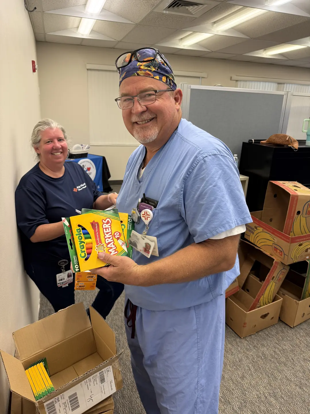 Registered Nurse Teresa Clarke and Registered Nurse First Assist Rob Barlow inventory supplies in the Supplies 4 Success Teacher Store.