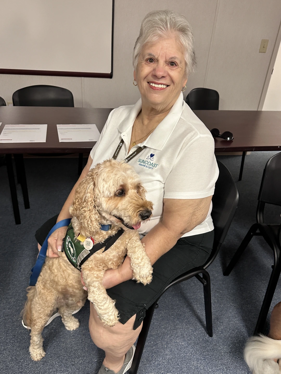 Photo of woman and her therapy dog.