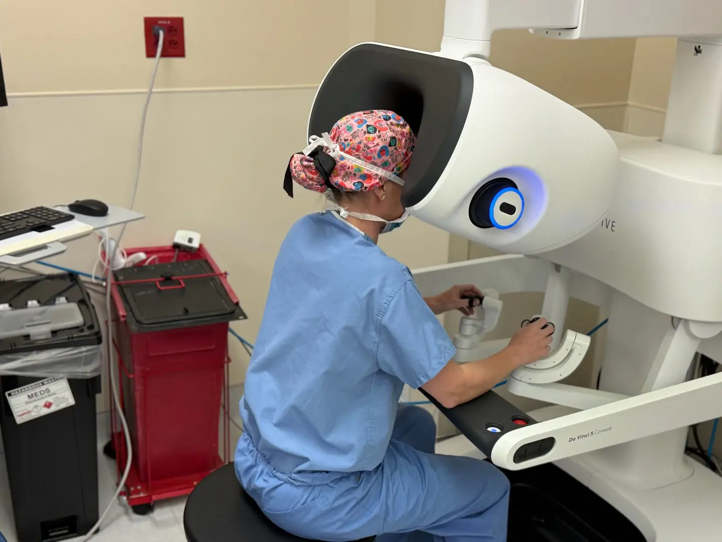 Physician performs minimally invasive procedure with new robotic surgical technology.