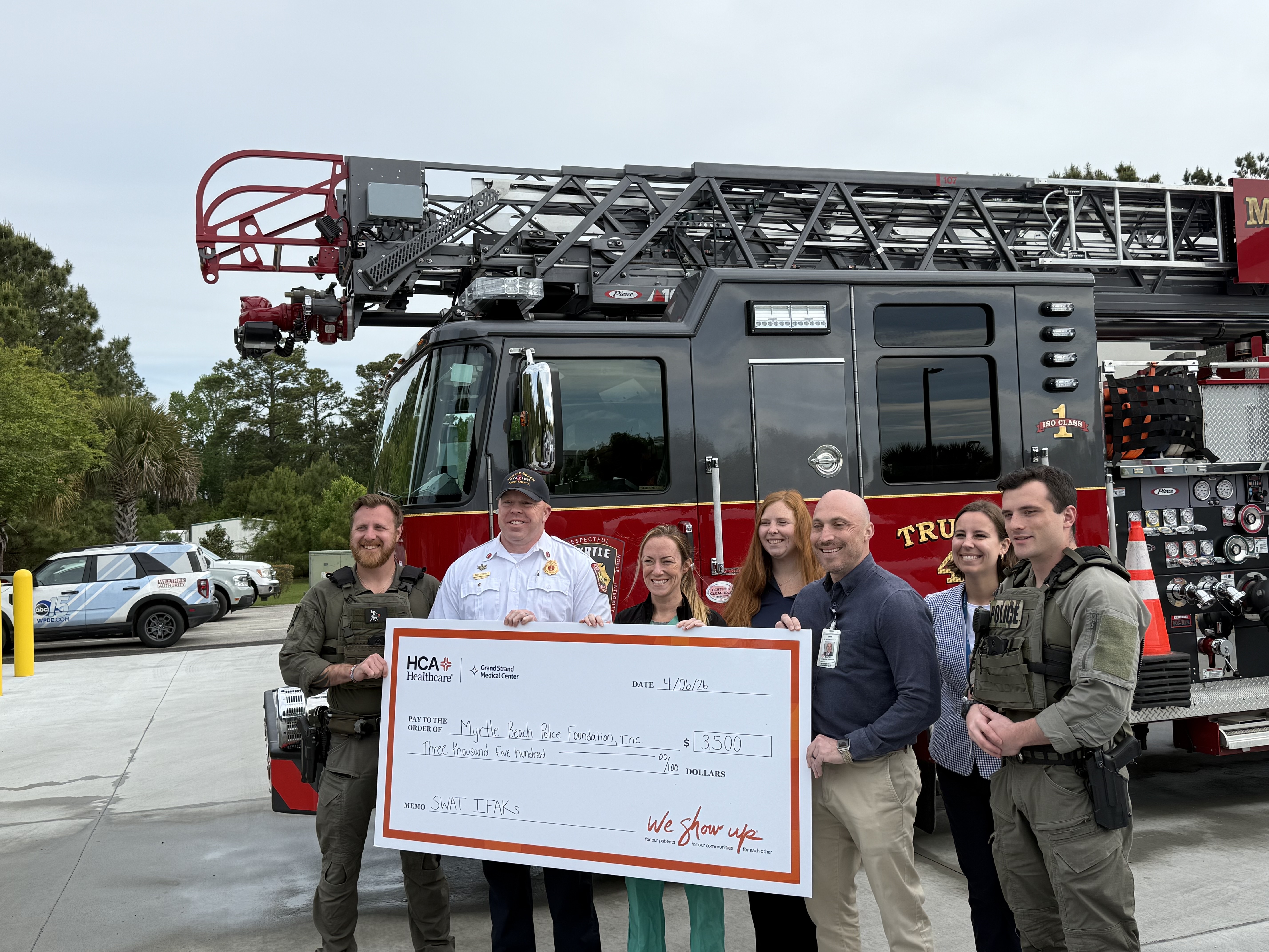 Leaders from Grand Strand Heath present a check to the Myrtle Beach Police Department’s SWAT team for the purchase of Individual First Aid Kits