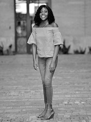 Kalynn Holmes-Butler standing in the street.