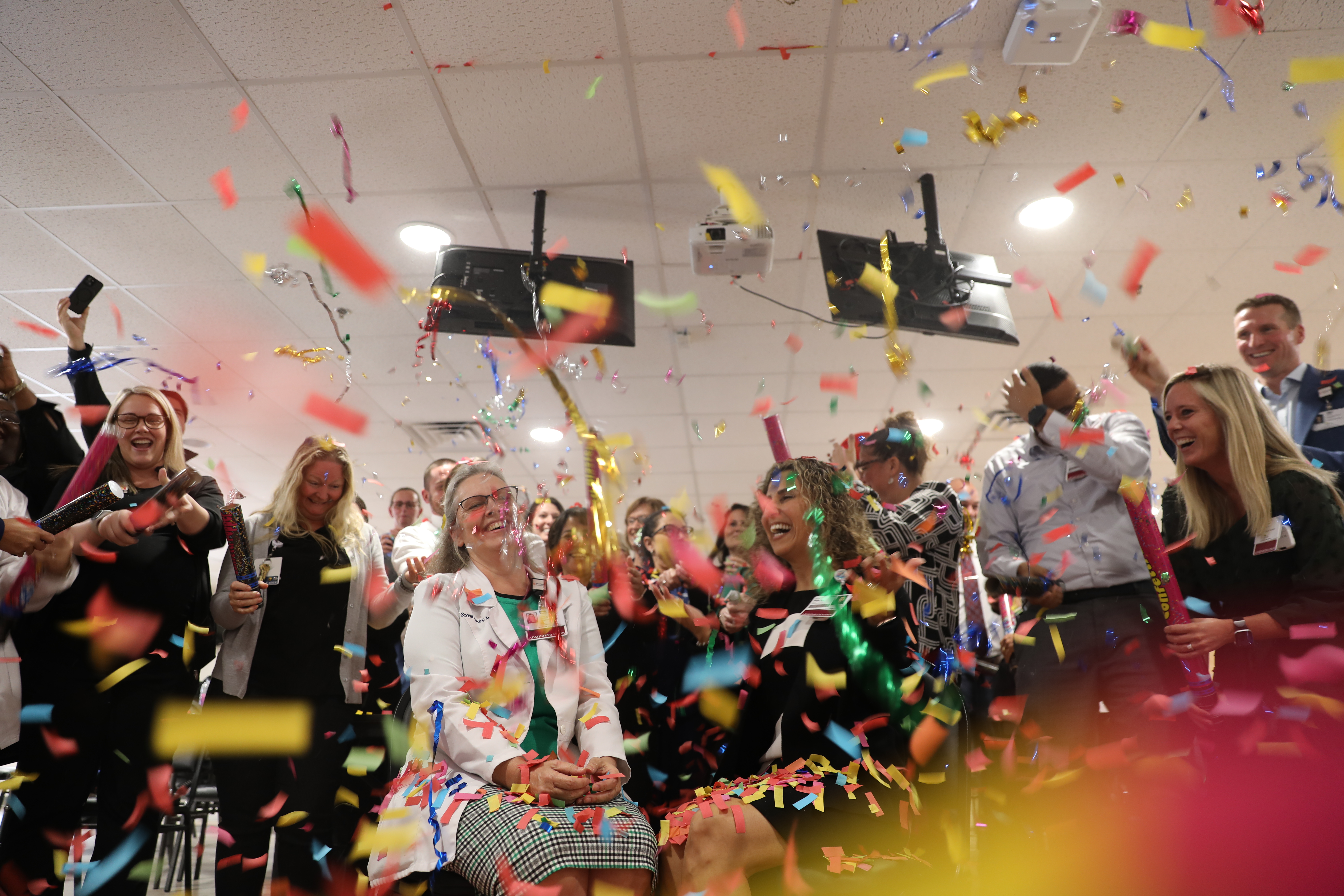 Nursing leaders celebrate the Pathway to Excellence designation. Seated center are Sonna Harding, chief nursing officer at HCA Florida Ocala Hospital, and Sue DeLeon, chief nursing officer at HCA Florida West Marion Hospital.