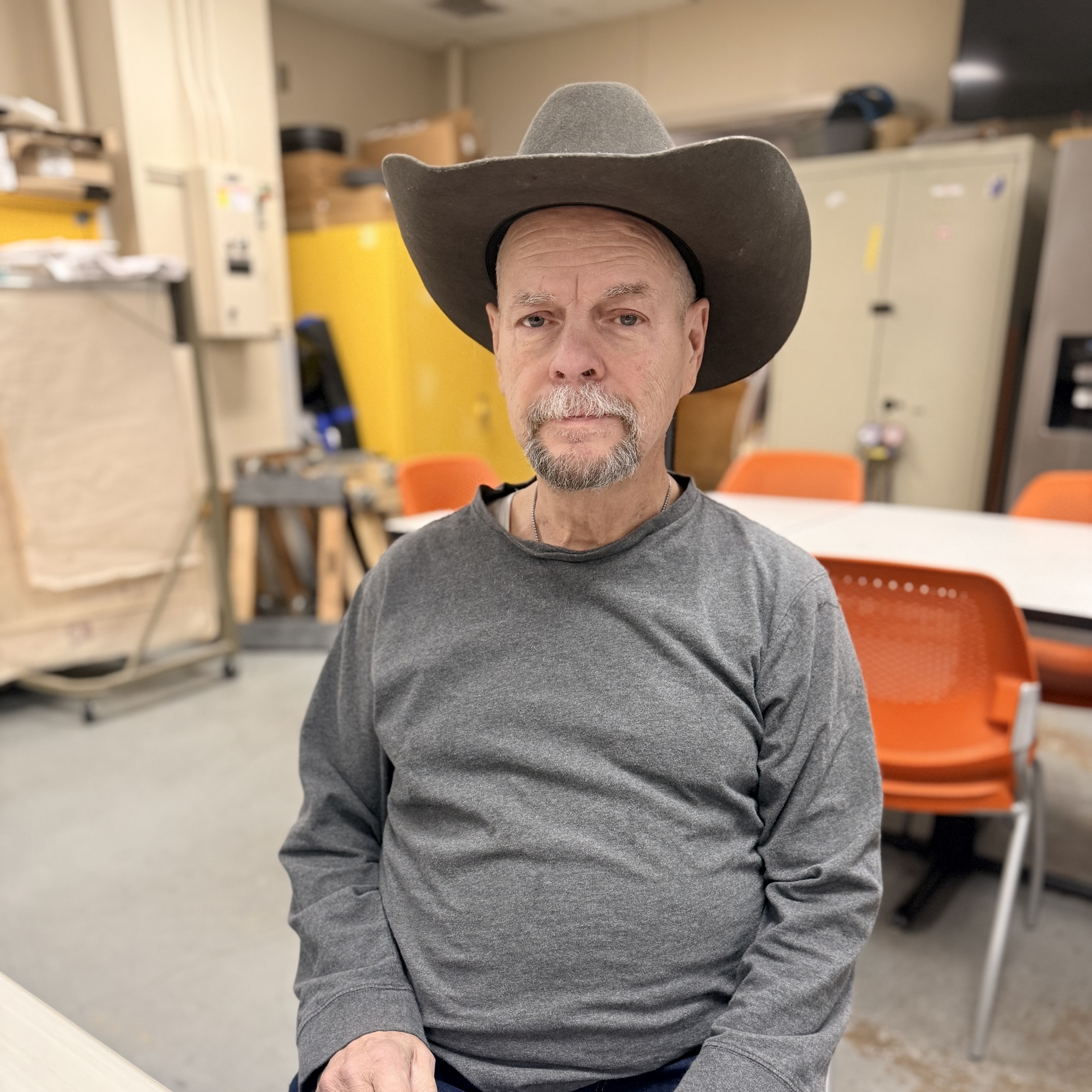 Wendell sitting in a chair with a hat on.