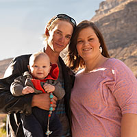The Bakers and Braxton pose in a desert setting. 