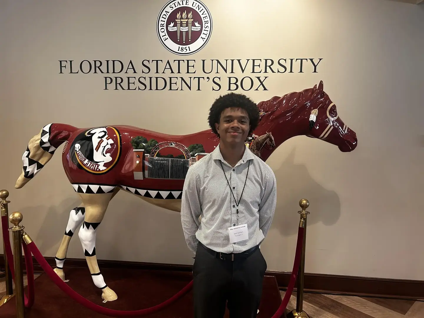 Patricia First Scholarship Winner Sean Graham smiling and posing for a picture,