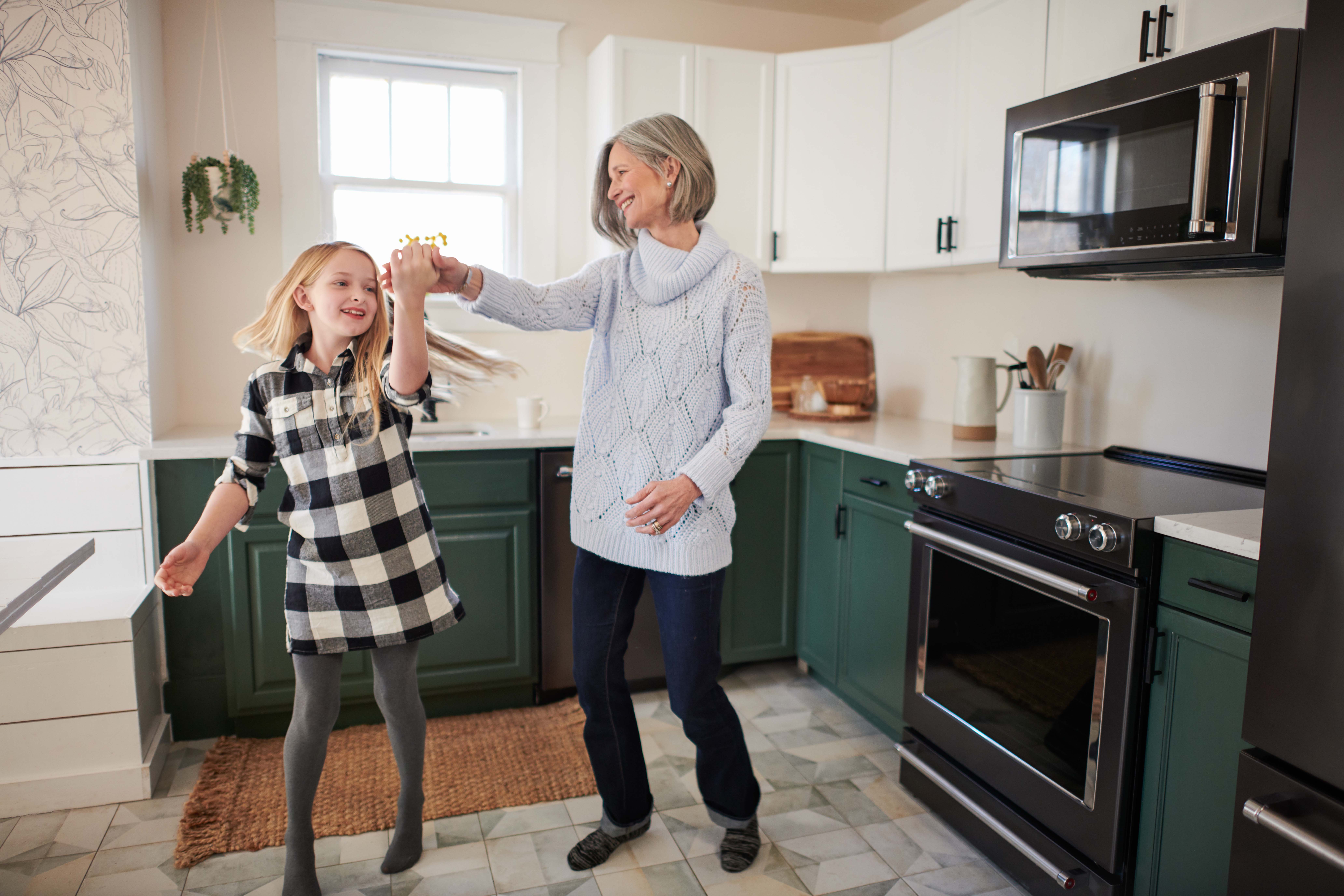 Woman and a child dancing.