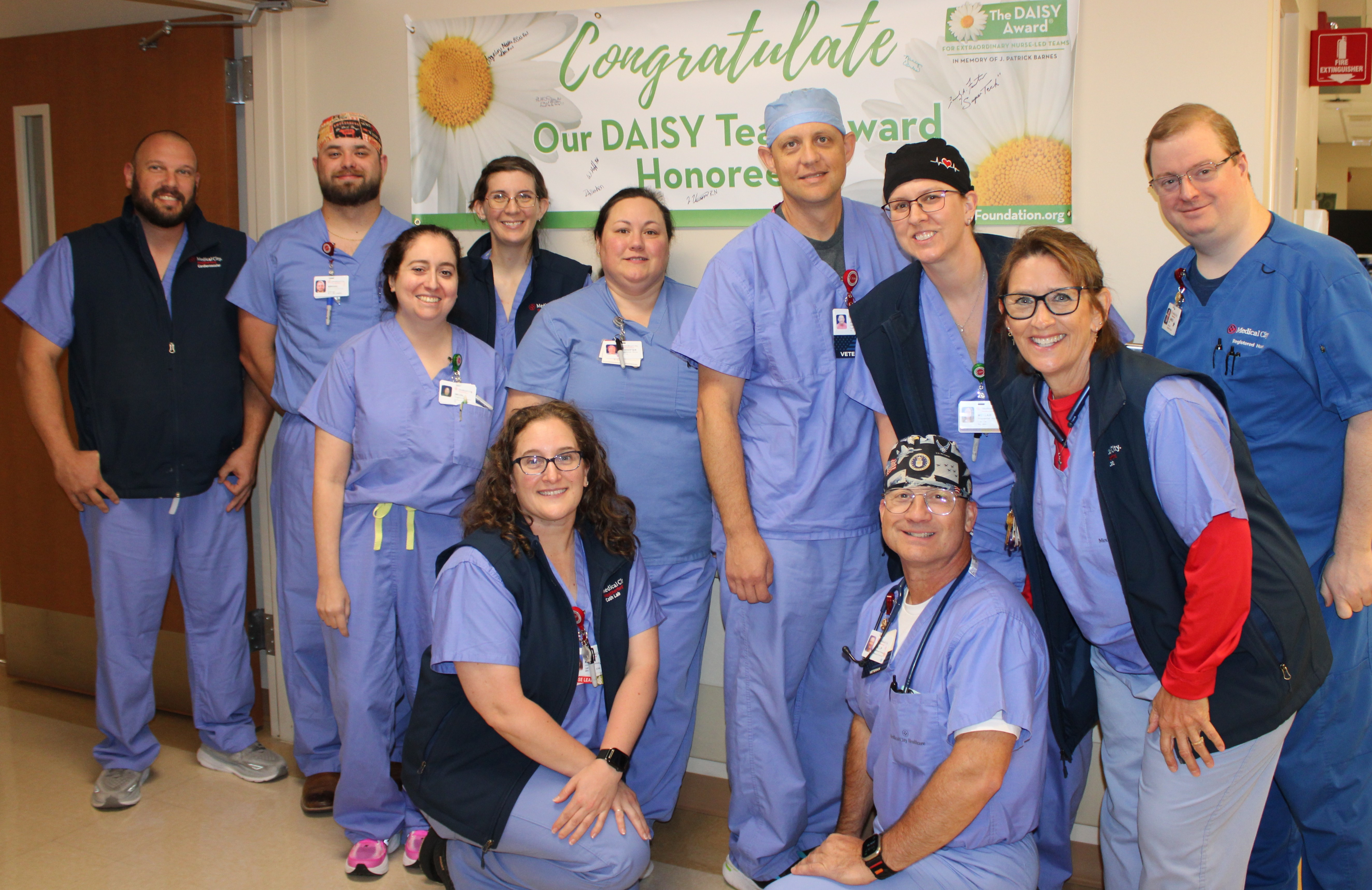 Image of Medical City Weatherford's cardiovascular team and staff smiling as they open the new ECMO activation center.
