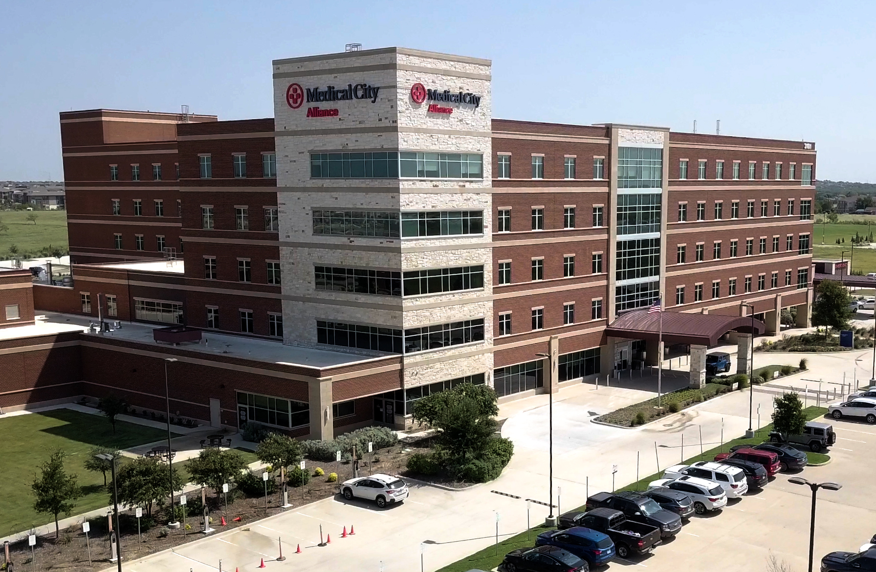 Exterior daytime drone's-eye photo of Medical City Alliance Hospital