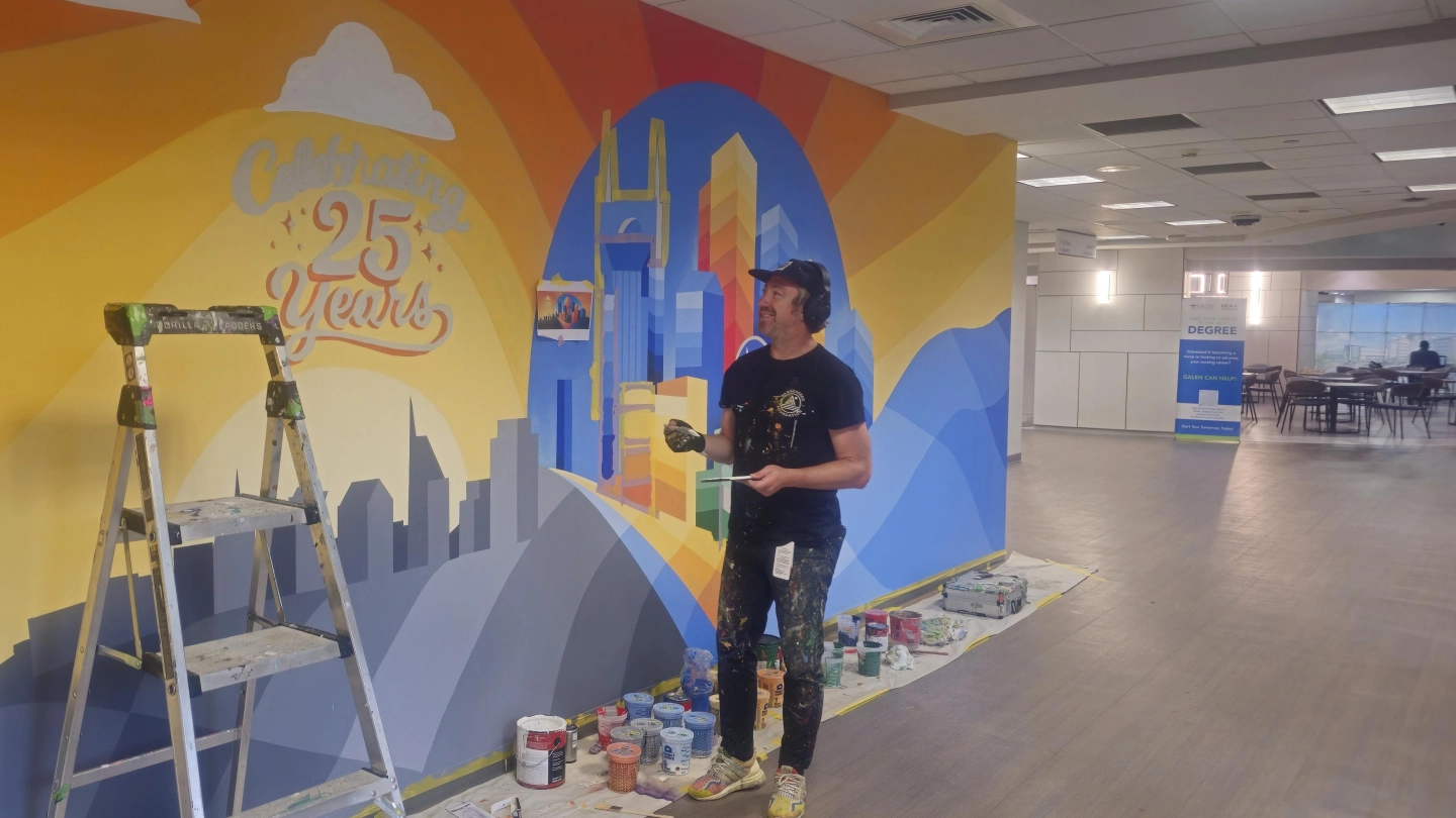 Nathan Brown, the artist who created the anniversary mural.