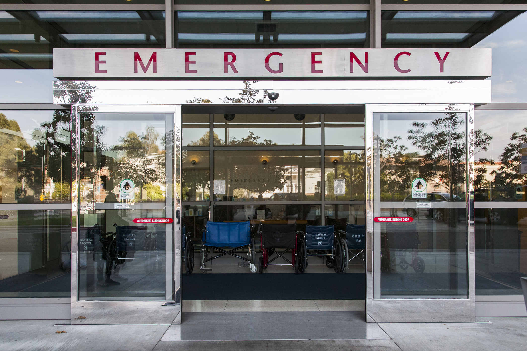 The open sliding door entrance of an emergency department at a hospital.