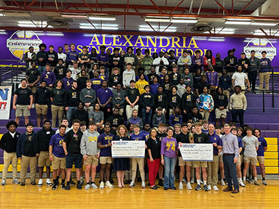 Alexandria Senior High's football team stand in the gym after winning for the second year for raising money for the American Cancer Society.