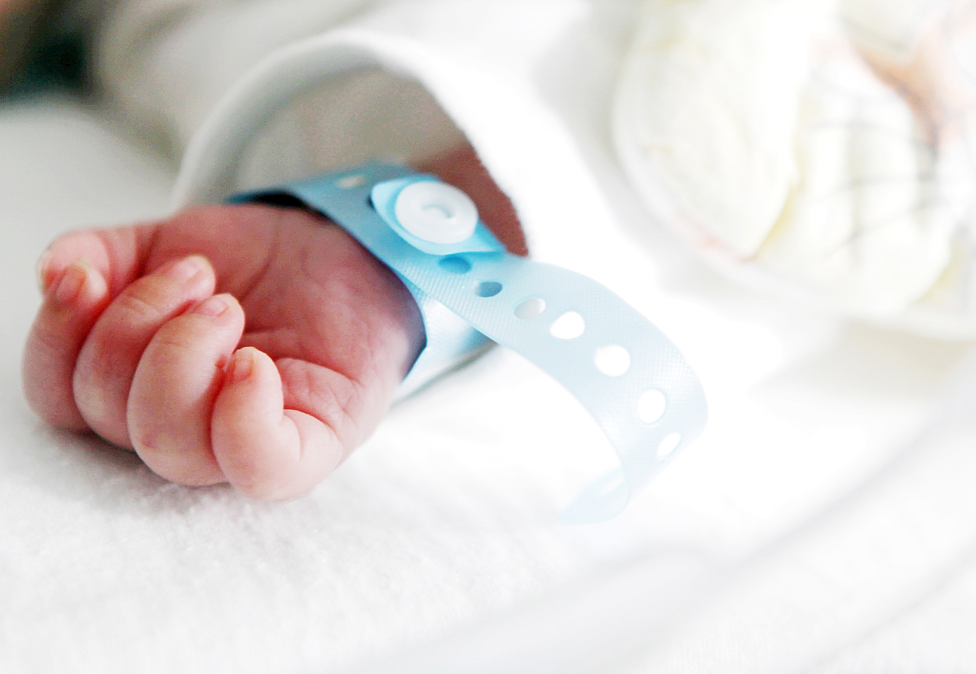 Neonatal patient hand with armband