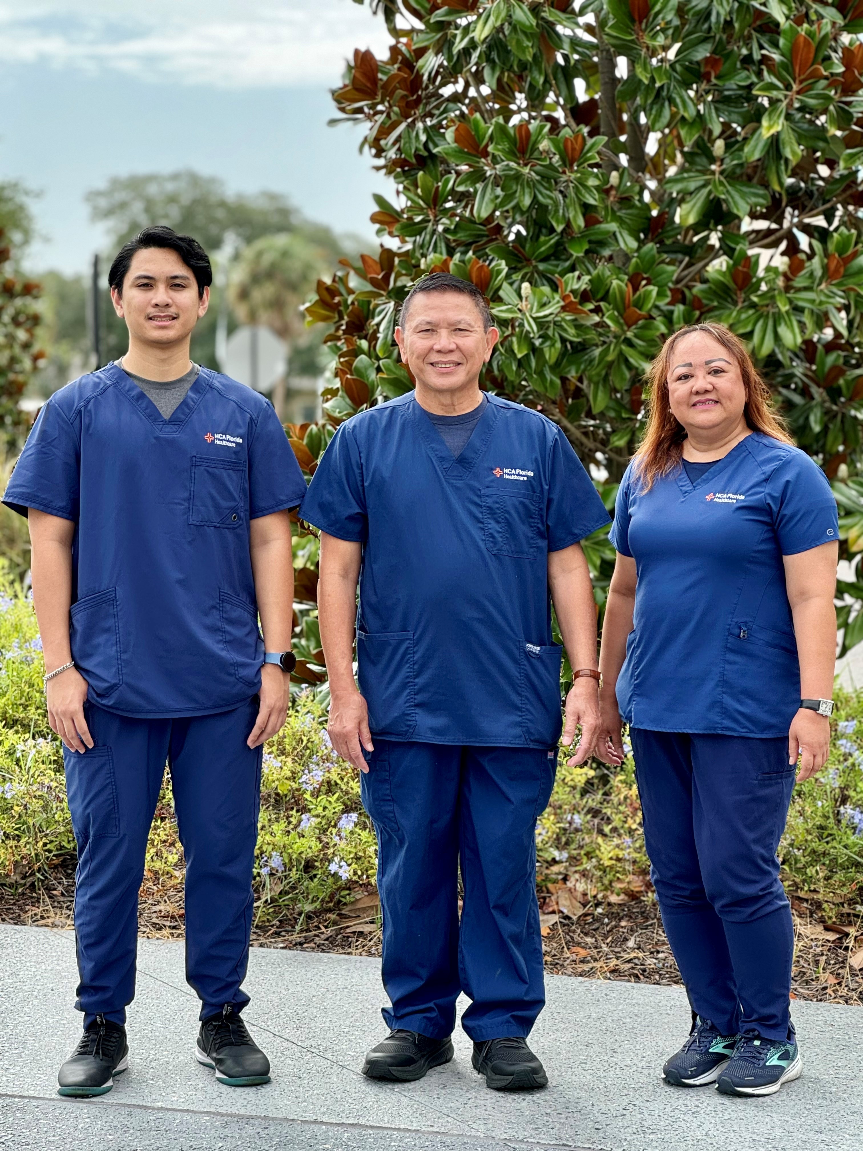 Nurse group in blue uniform of son, dad and mom