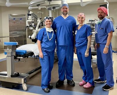 Spine surgeon Dr. Eric Emanski and operating room team.
