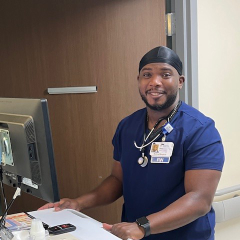 Samuel Powell, RN, smiles while working at StoneSprings hospital.
