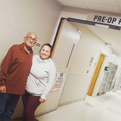 Deanna and her father Richard Navejar standing outside the pre-op hallway at Methodist Hospital Specialty and Transplant.