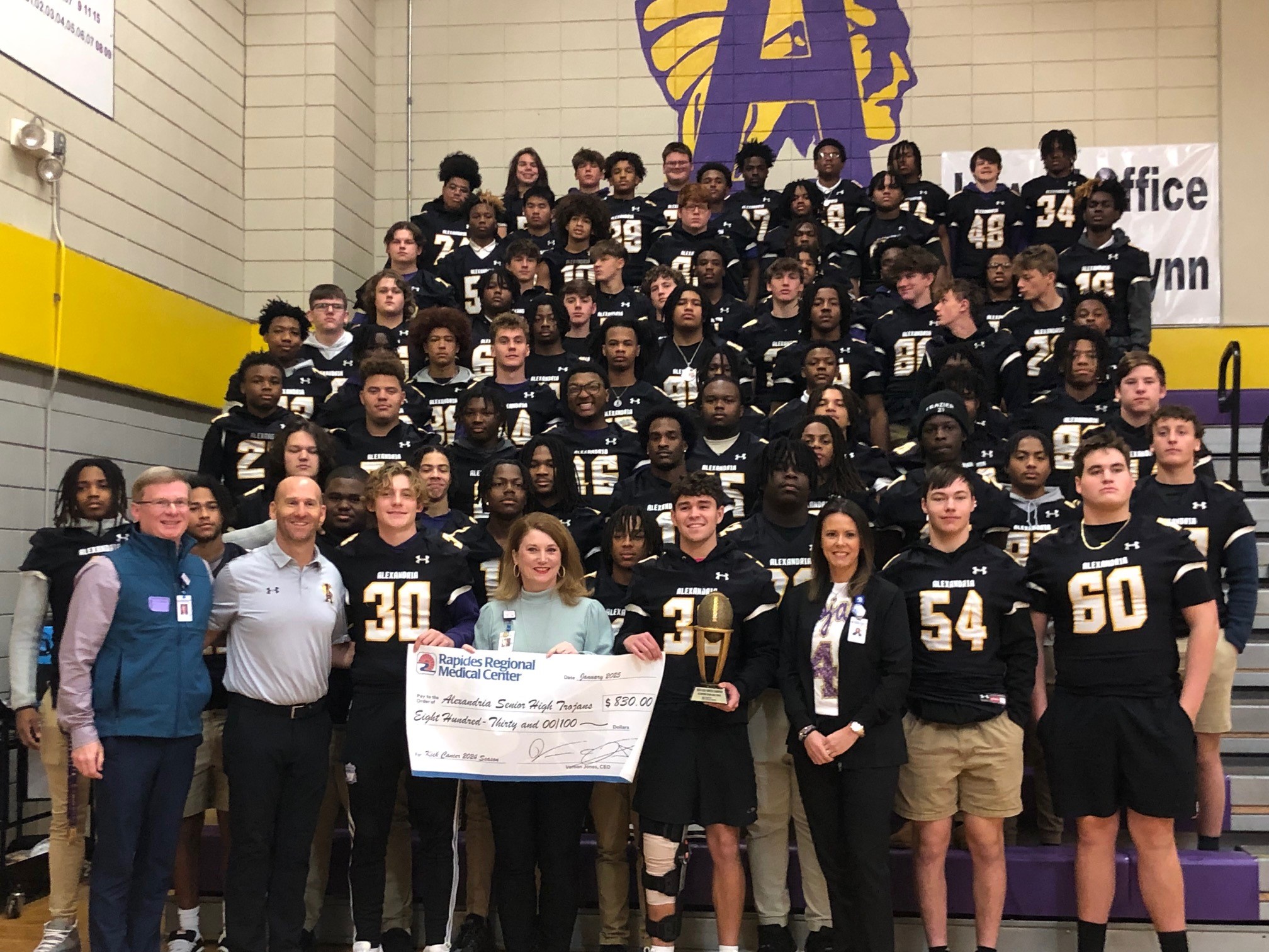 The Alexandria Senior High football receives their third straight Golden Football award and check for $830 for money raised during the 2024 high school football season. An equal amount was raised for the American Cancer Society.