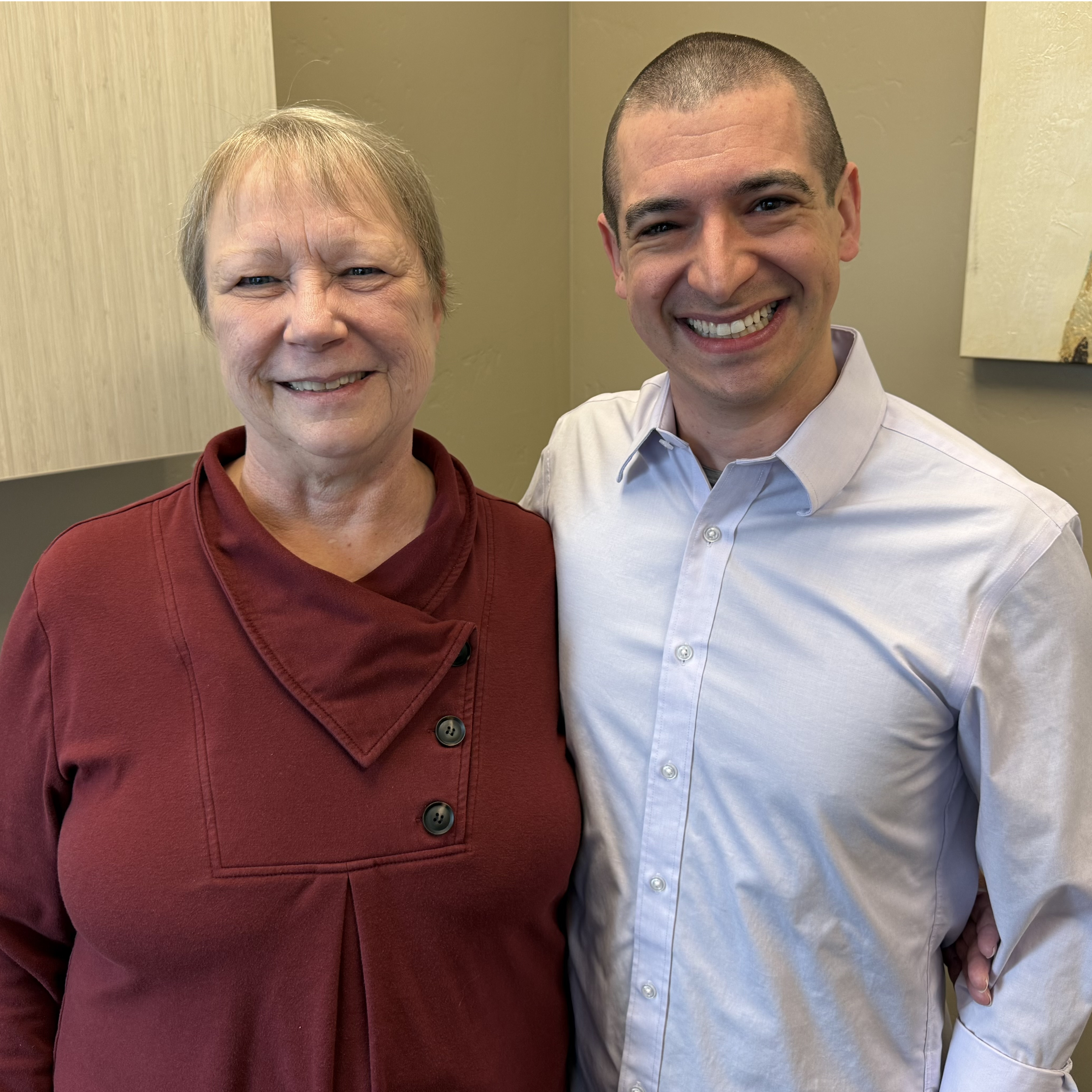 Debra Hersom, an anal cancer patient at St. Mark's Hospital, smiles next to her colon-rectal cancer surgeon, Dr. Matthew Bobel.