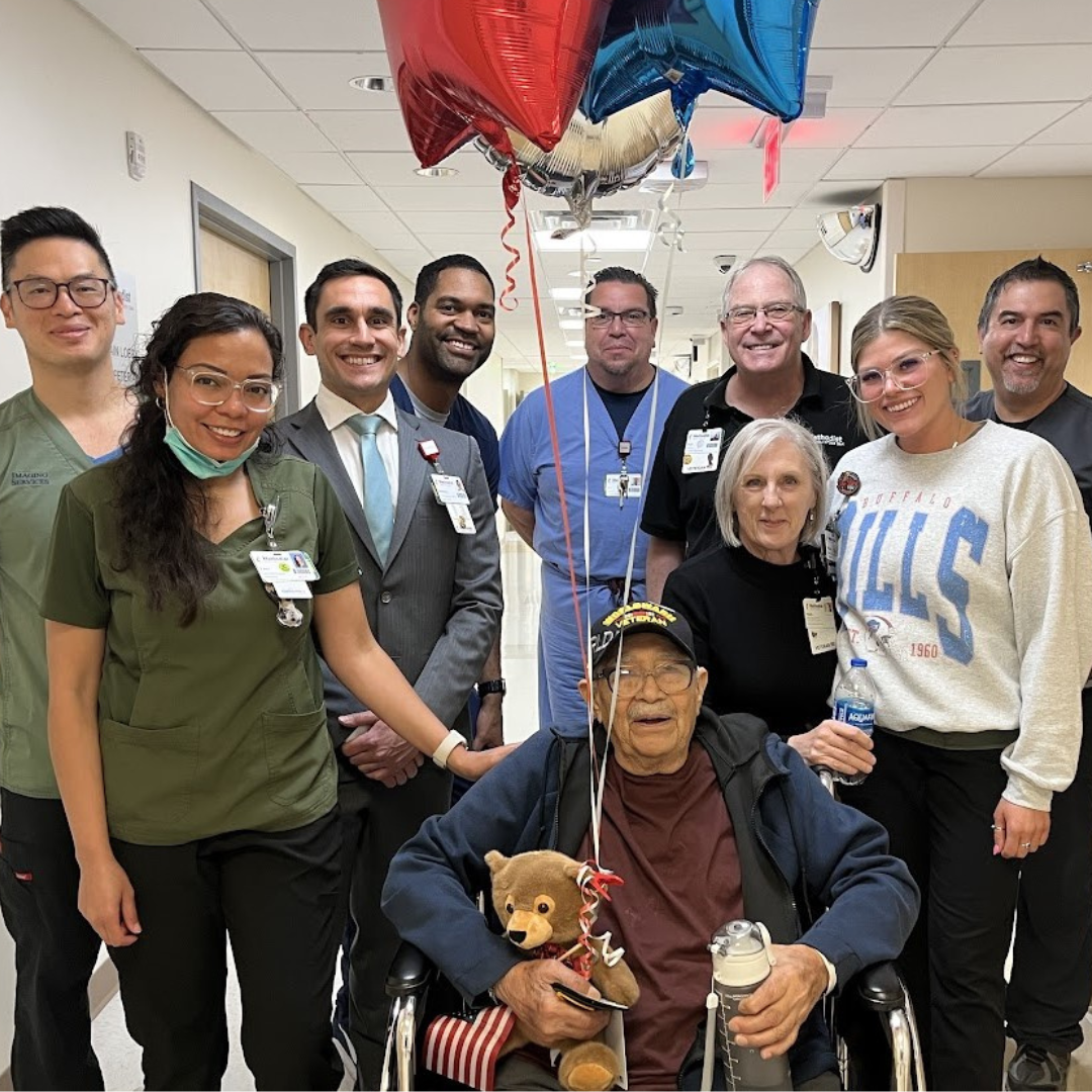 Methodist Hospital Stone Oak staff honors Veteran patient during hospital discharge.