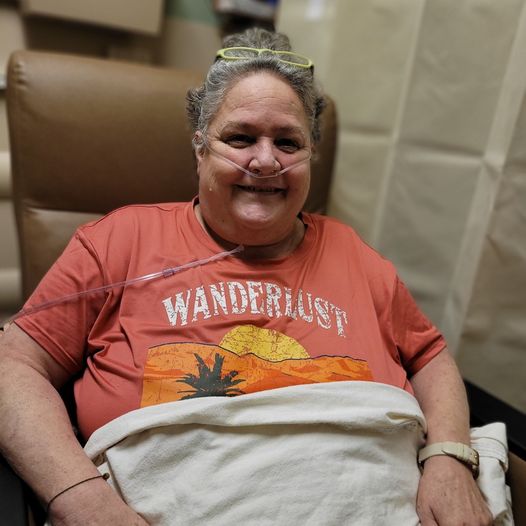 Sherri Morris safe and smiling in hospital.