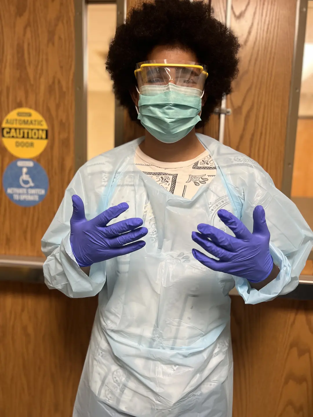 A member of the Boys and Girls club in doctor scrub outfit.