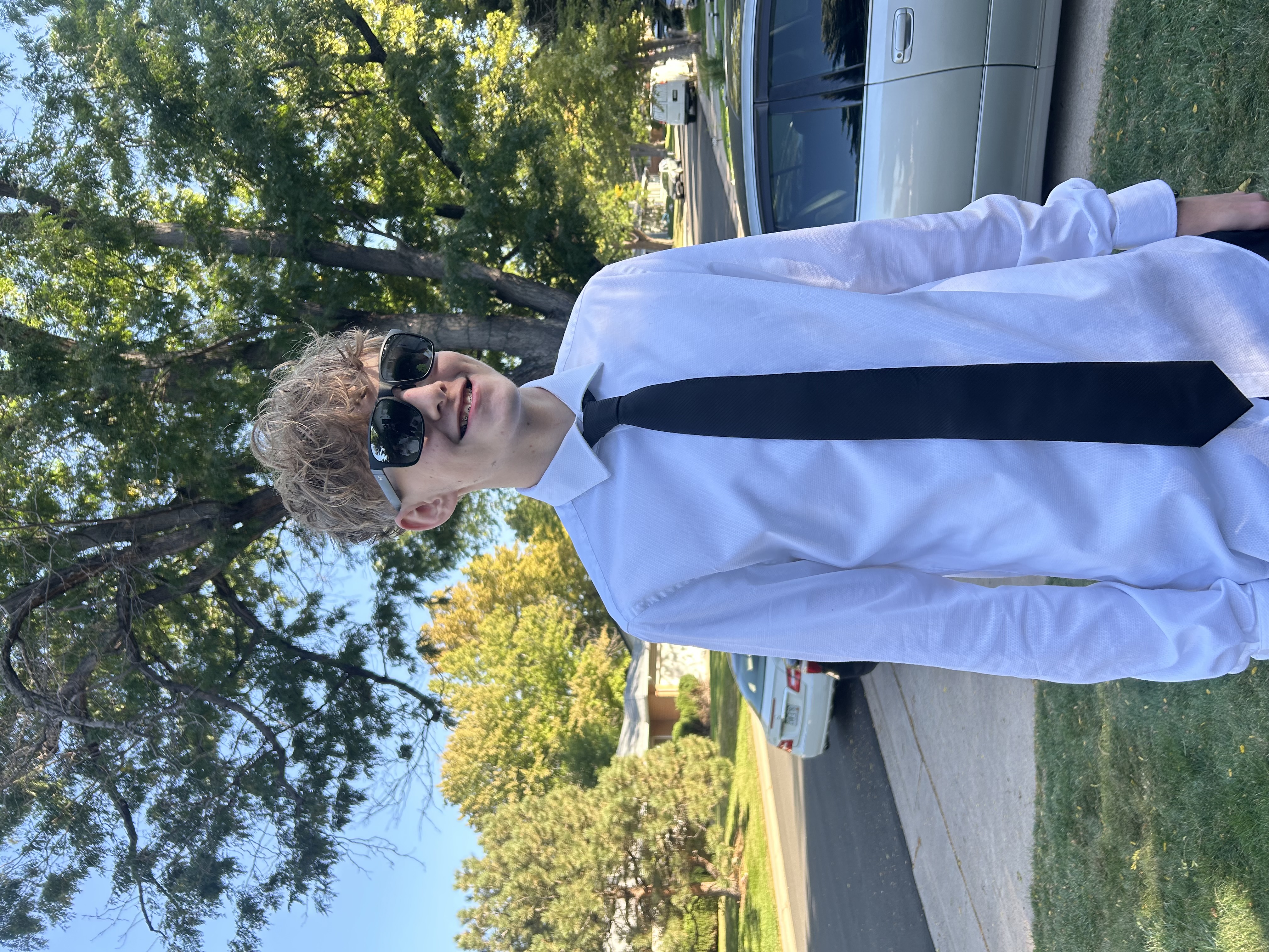Reven Alt in sunglasses and black tie.