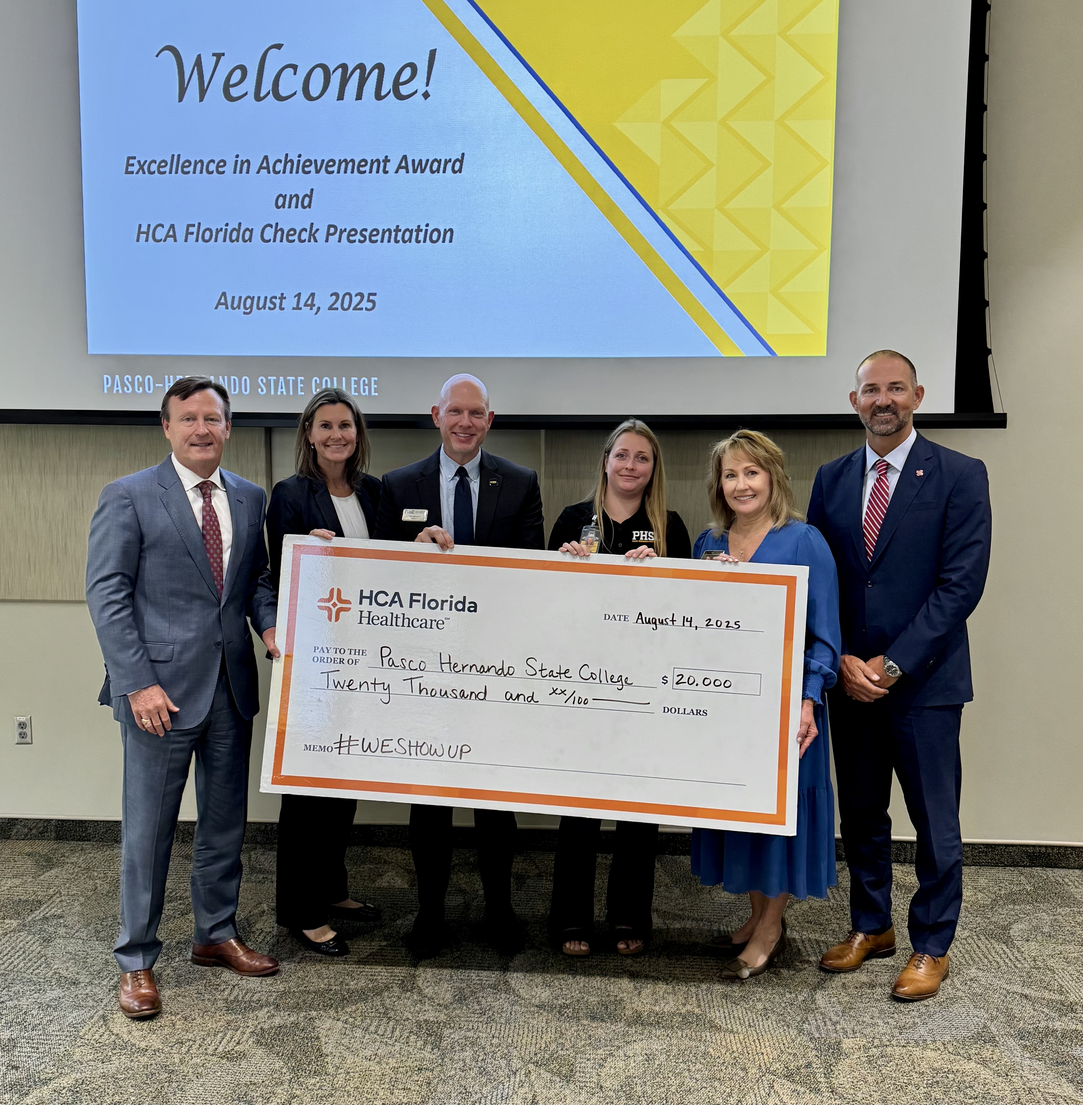 Photo showing of CEOs from Oak Hill Hospital, Trinity Hospital and Bayonet Point Hospital holding the check for $20,000 toward the nursing scholarship programs at PHSC.
