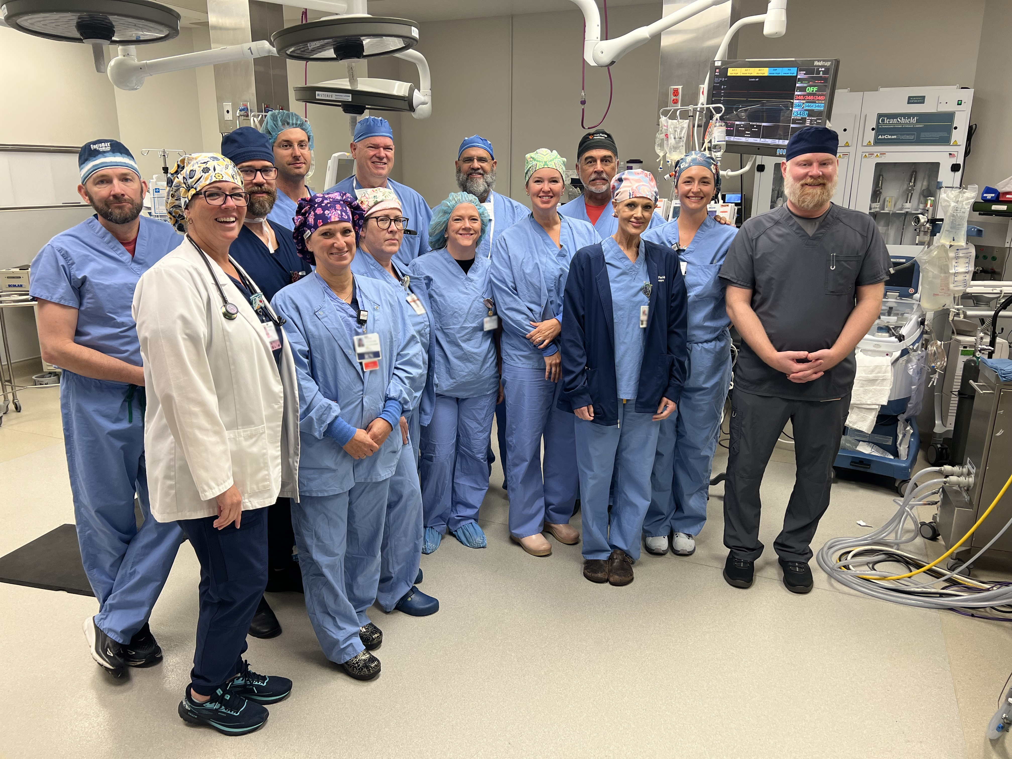 Cardiac team standing in an operating room.