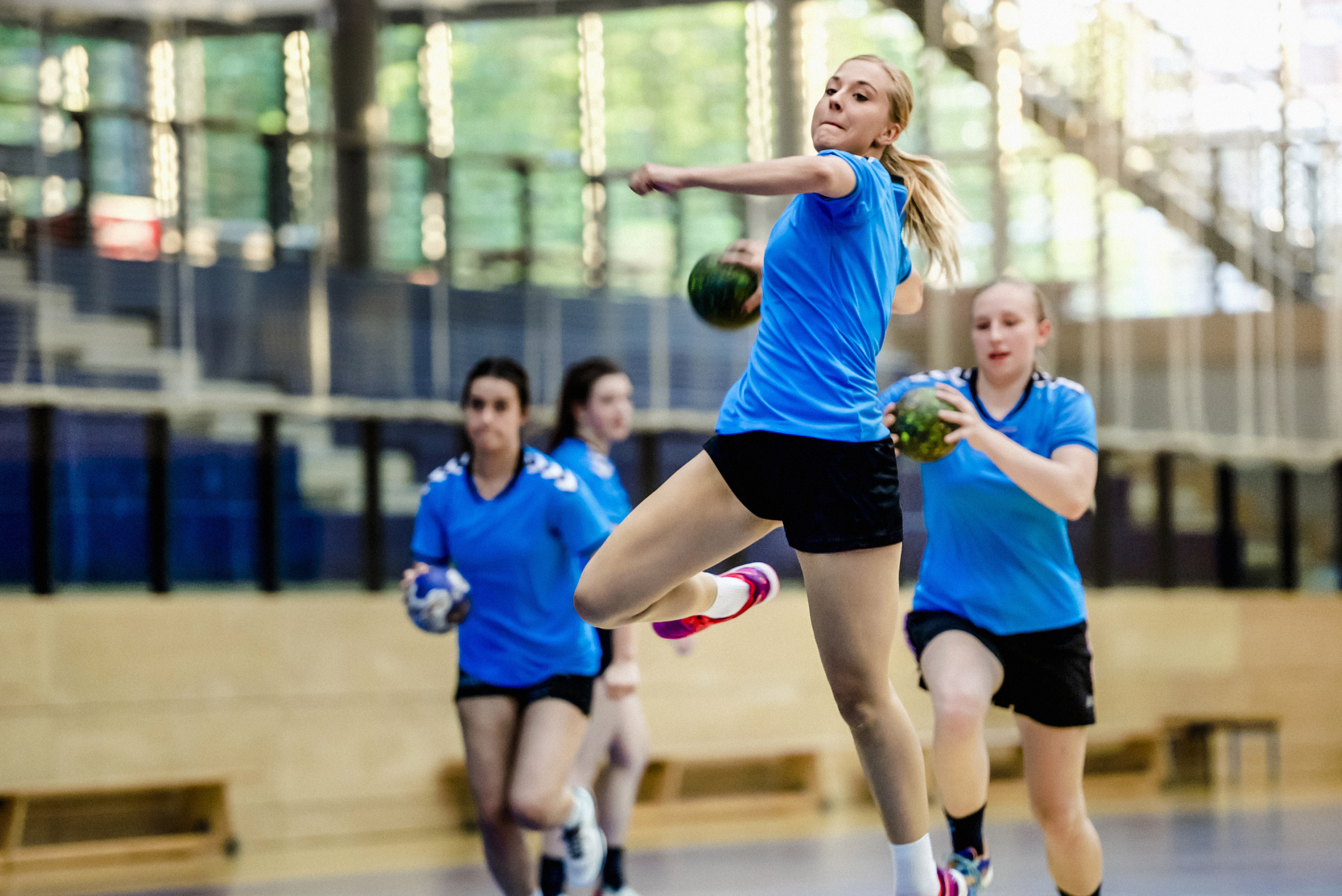 Female handball player throwing ball