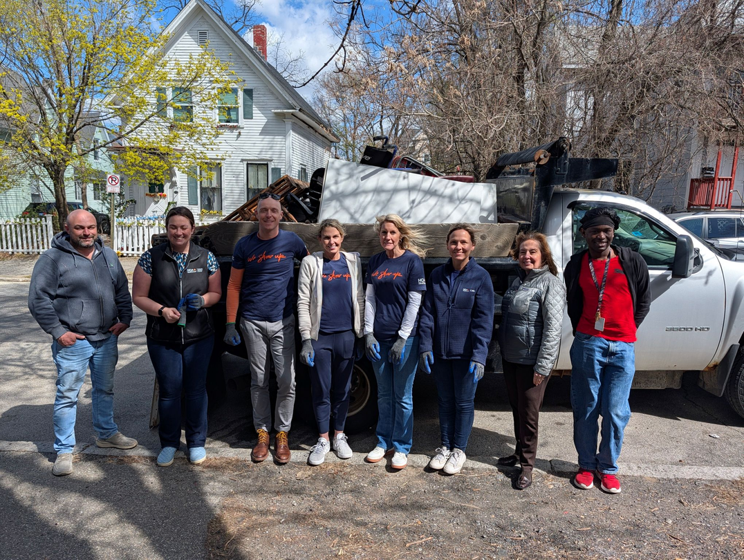 Catholic Medical Center colleagues pause for a photo during a 2026 Earth Day project.