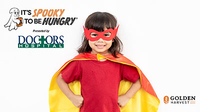 "It's Spooky to Be Hungry" sponsored by Doctors Hospital and Golden Harvest Food Bank. Features a child in a Halloween costume.