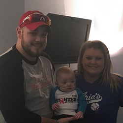 Baby Aric, with his father and mother Amelia.