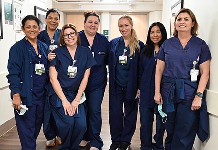 Good Samaritan Hospital Labor and Delivery team members pose for a picture in the hallway.