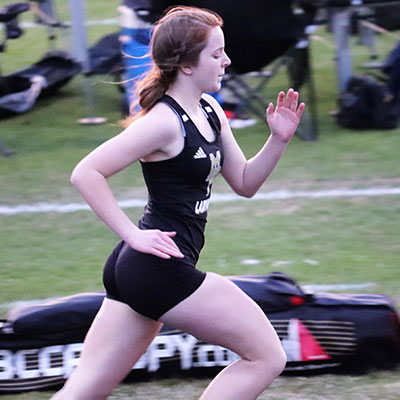 Alyssa Green is focused while running during a track event.