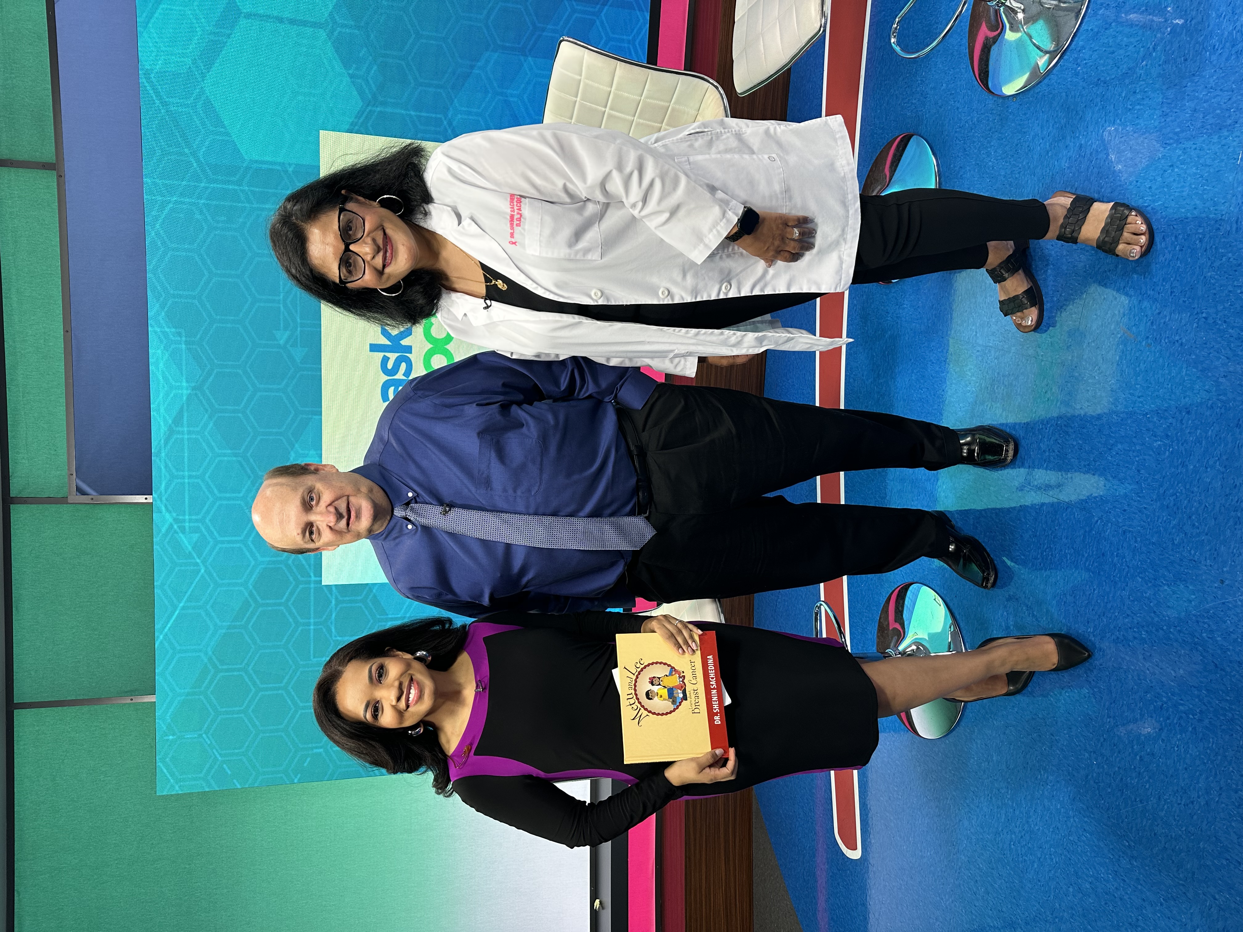 John with his breast surgeon and the news anchor