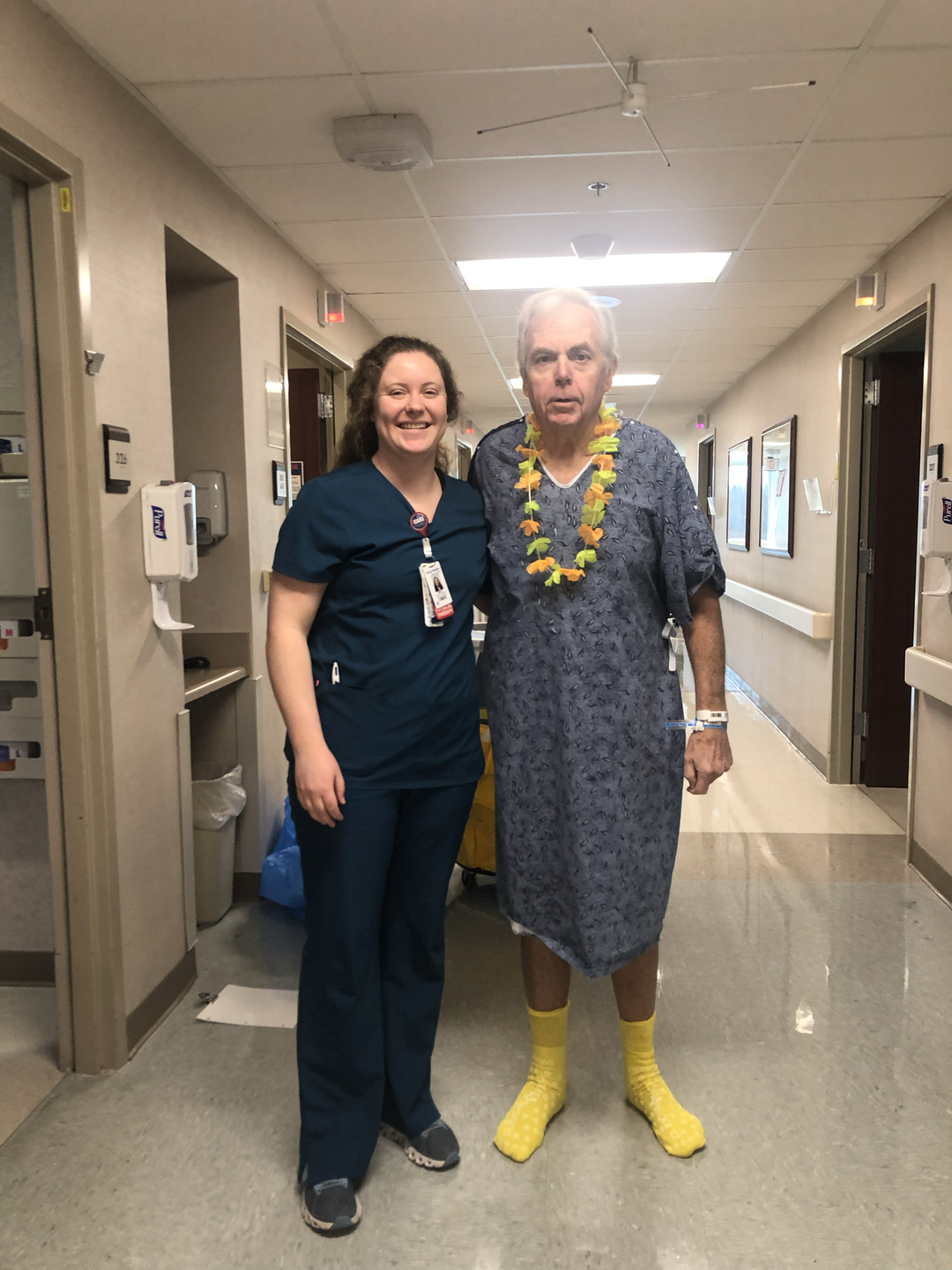 David Johnson with a nurse standing in the hallway of TriStar Skyline Medical Center.