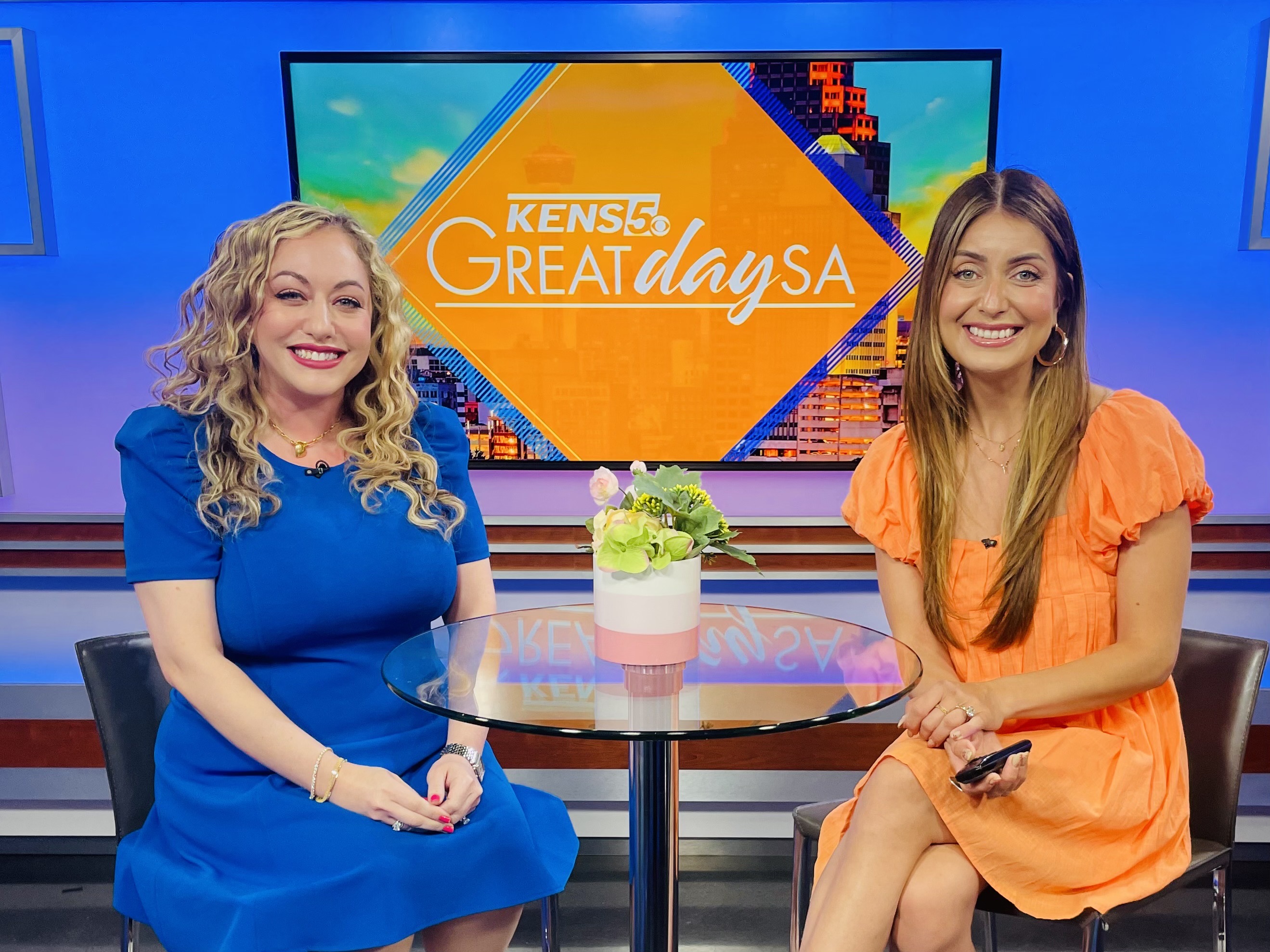Methodist Children's Hospital CEO Rachel Goldsmith and Great Day SA anchor Roma Villavicencio sitting at a table on the set