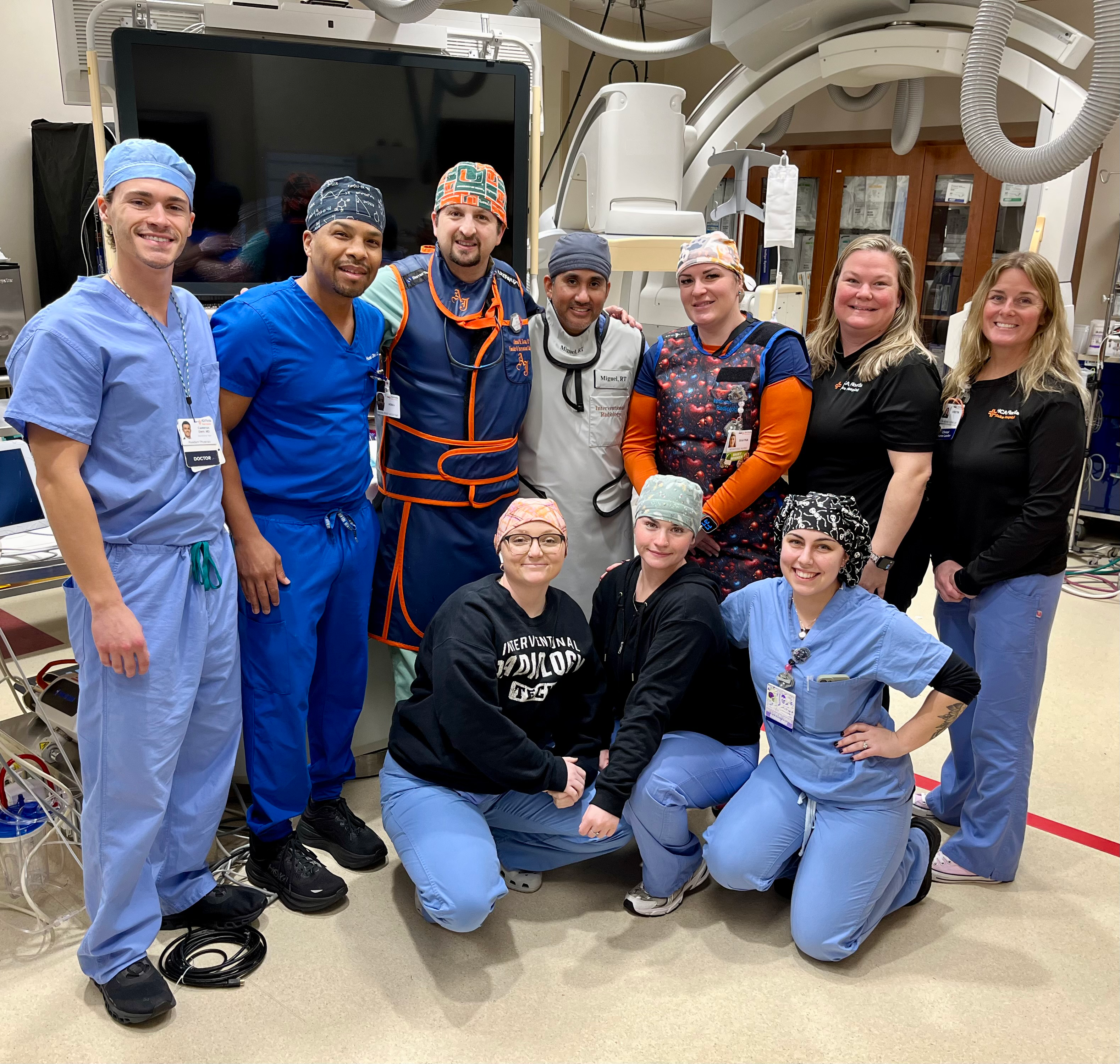 Dr. Ahmad Kattan and his team stand in front of the equipment.
