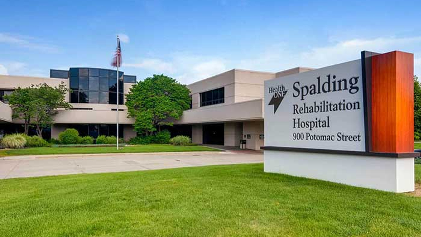 Exterior view of the Spalding Rehabilitation Unit at Presbyterian/St. Luke's Medical Center on a sunny day