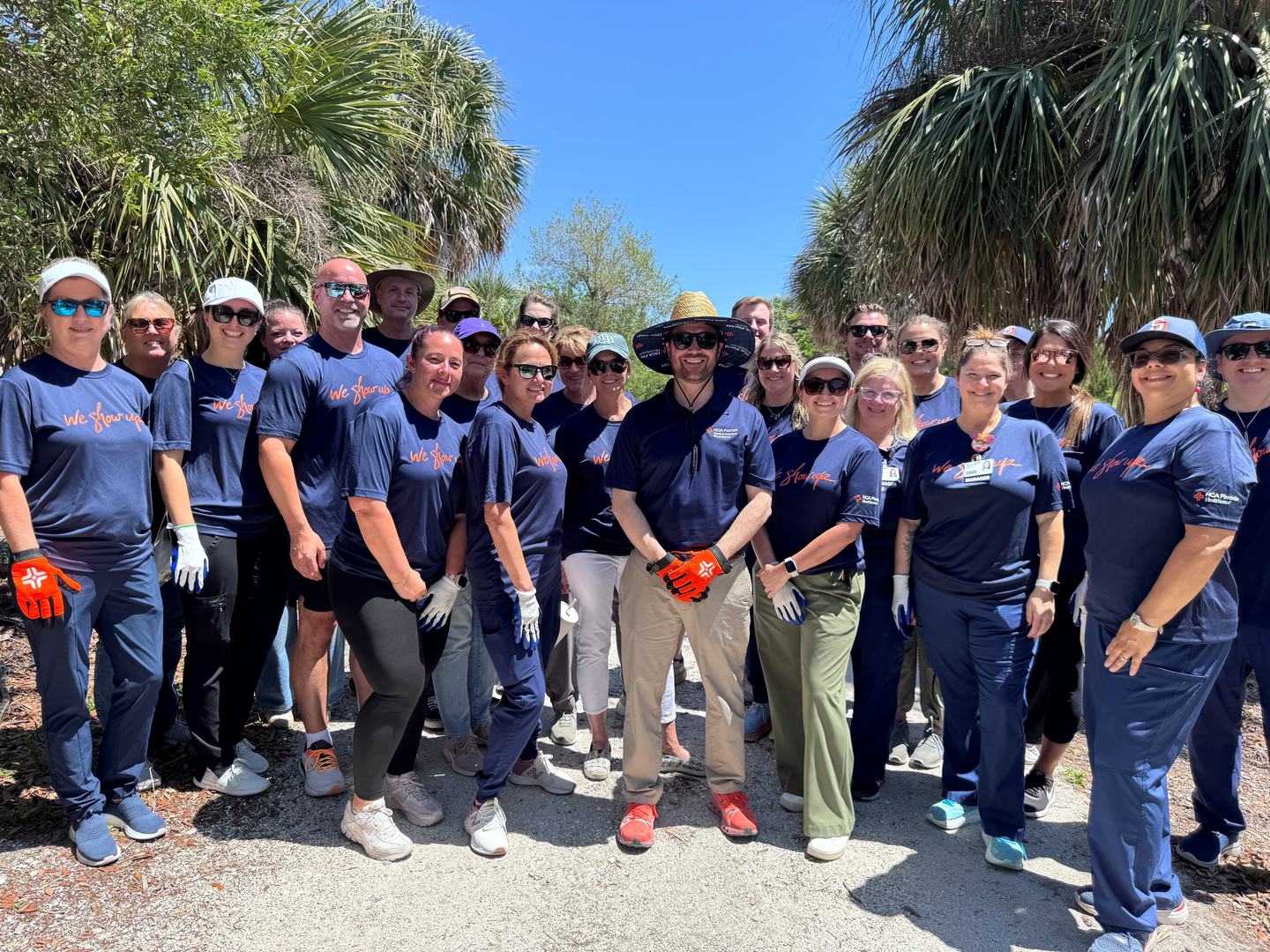 Colleagues from HCA Florida Sarasota Doctors Hospital participate in a volunteer cleanup effort in Venice
