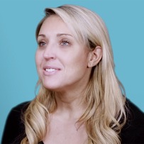 Lindsey Gyger smiling and wearing a black shirt.
