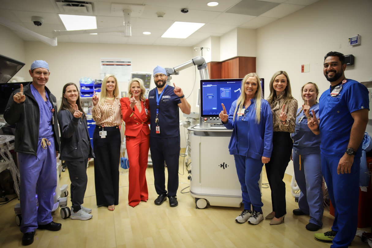 Colleagues standing in a group in an operating room