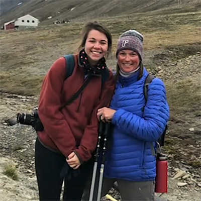 Meg and her daughter pause to smile for the camera while hiking across Norway.