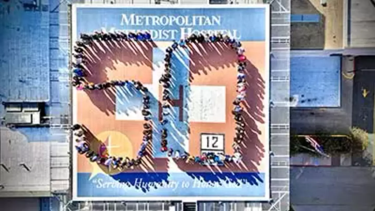 Methodist Hospital Metropolitan Staff on the room of the hospital forming the number 50 in celebration of it's anniversary.