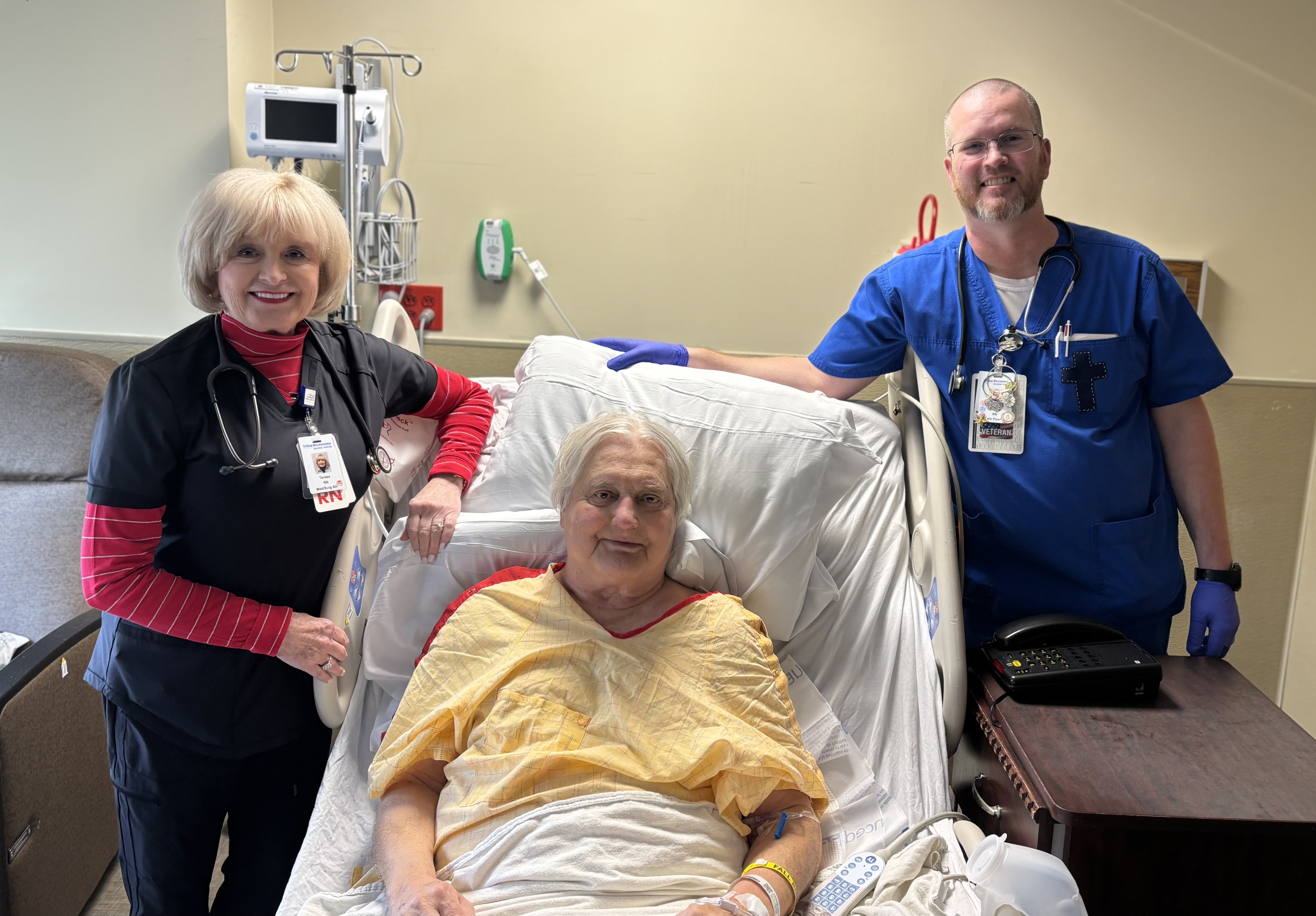 Larry with his nursing team at his bedside.
