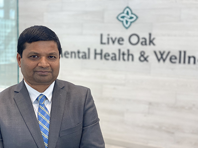 Dr. Ellur in Live Oak Mental Health lobby.